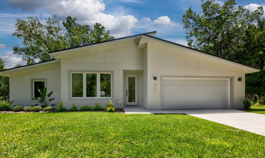 kit home exterior, white with two car garage