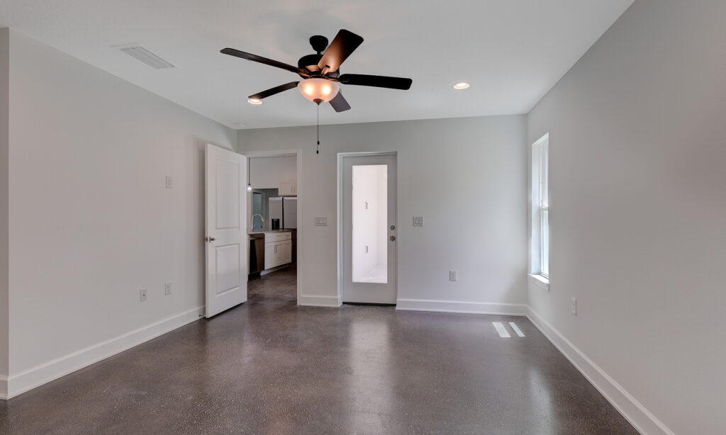 kit home bedroom with hardwood floors and ceiling fan